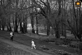   At Meadowlark Botanical Gardens in Vienna, Virginia, a girl sprints toward her father, who carries her wandering sister.
